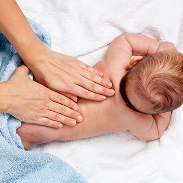 back massage to soothe colicky baby